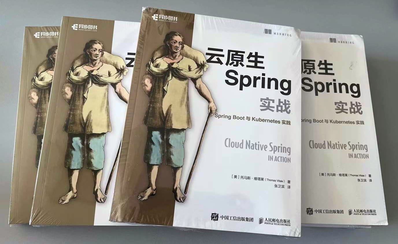 Printed copies of the Chinese edition of "Cloud Native Spring in Action - With Spring Boot and Kubernetes" by Thomas Vitale